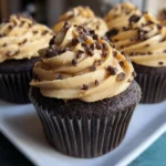 Chocolate peanut butter cupcakes topped with creamy peanut butter frosting