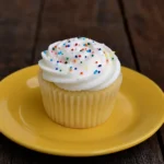 dairy free cupcakes with vanilla frosting on a plate