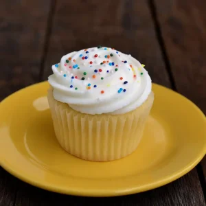 dairy free cupcakes with vanilla frosting on a plate