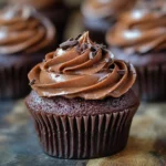 Eggless chocolate cupcakes topped with rich chocolate frosting
