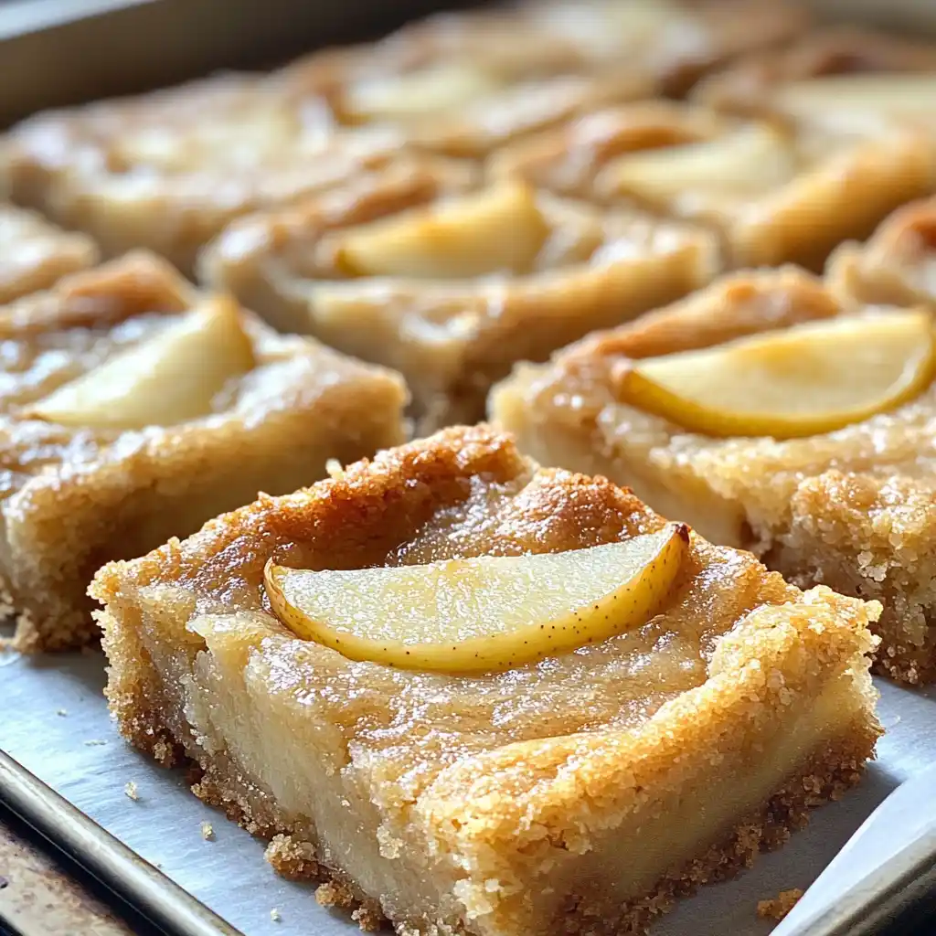 Brown Butter Pear Bars fresh from the oven with golden edges.