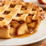 Homemade apple pie with golden flaky crust and cinnamon-spiced apple filling